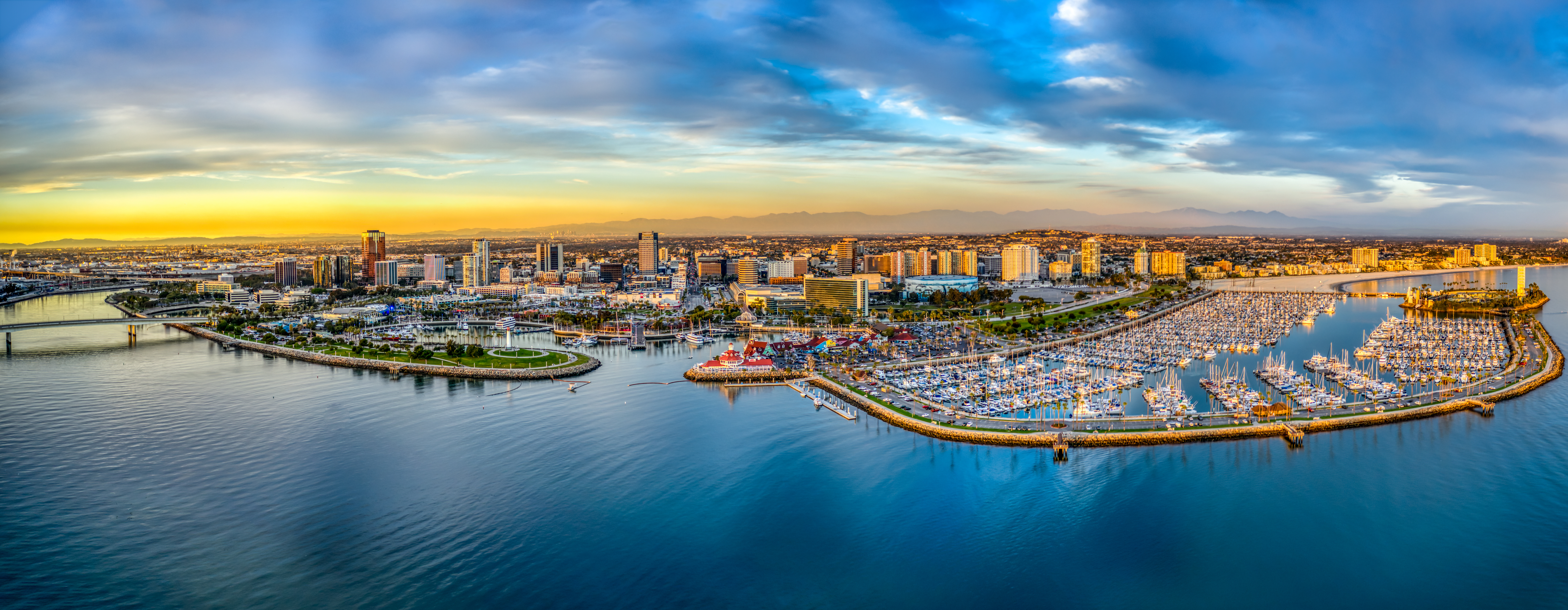 Aerial view of the Long Beach marina and downtown skyline at sunset